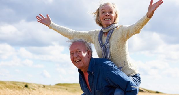 Man giving wife piggyback ride