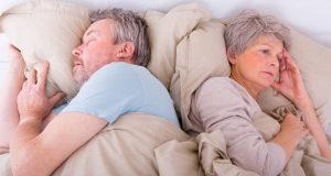 woman lying awake in bed