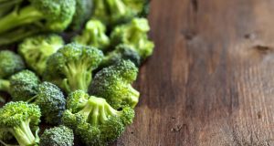 fresh broccoli on wooden table