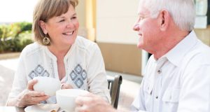 Happy senior couple drinking coffee together