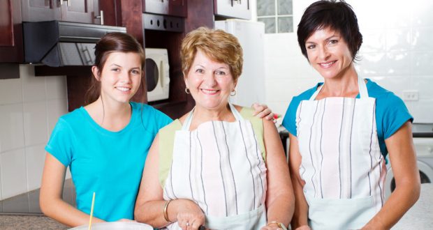 Three generations cooking together at home