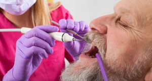 Man having his teeth examined