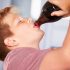 Young boy drinking soda from the bottle