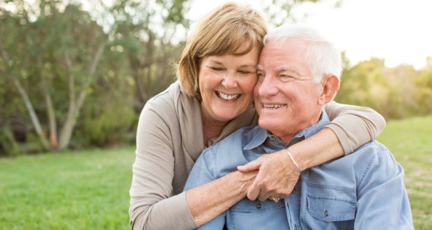 Senior couple hugging and smiling