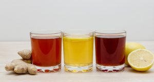 A selection of colorful kombuchas in clear glasses