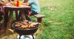 Barbecue grill and picnic table outside