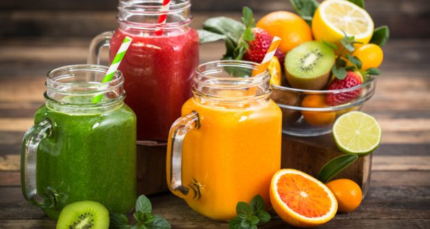 Glass jars filled with fruit juices