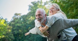 Happy senior couple having fun together outside