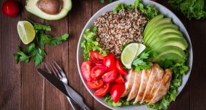 Salad bowl with quinoa, chicken, avocado, tomato