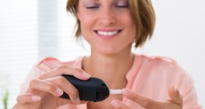 Woman checking her blood sugar