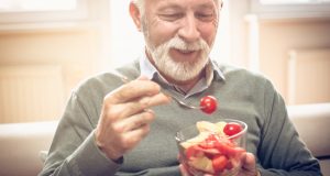 Man enjoying bowl of veggies