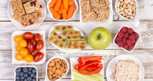 Variety of snacks on wooden table