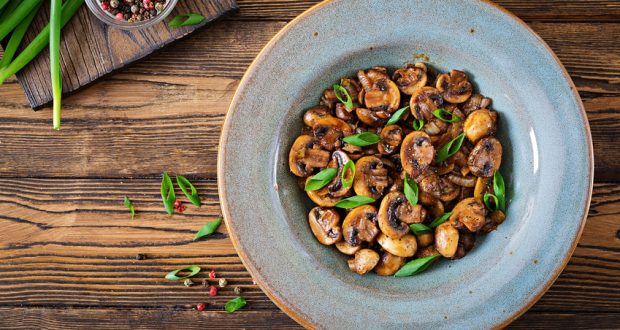 Bowl of mushrooms with herbs