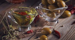 Olive oil and olives in glass bowls