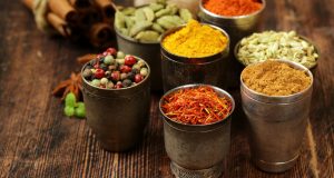 small pots of colorful spices