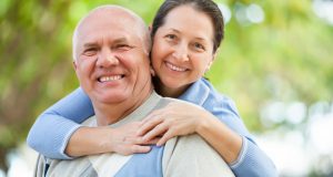 Smiling mature couple outside