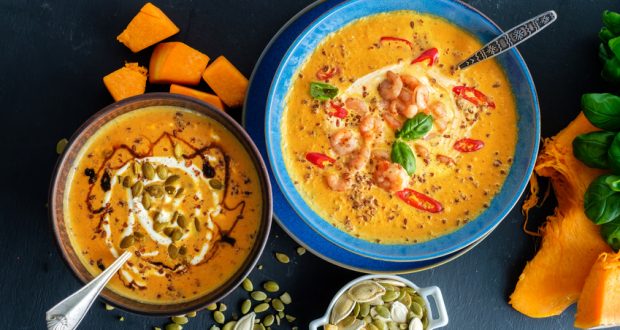 Bowl of pumpkin soup in blue bowl