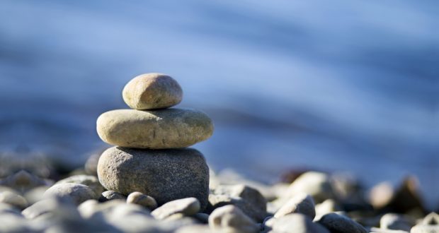 meditation stones against ocean background