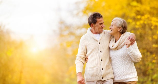 couple walks outside in autumn