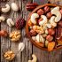 Mixed nuts in bowl on wodoen table