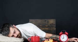 Man asleep at table after meal