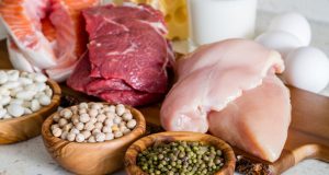 slices of poultry, beef, fish on wooden cutting board