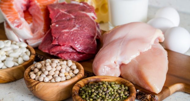 slices of poultry, beef, fish on wooden cutting board